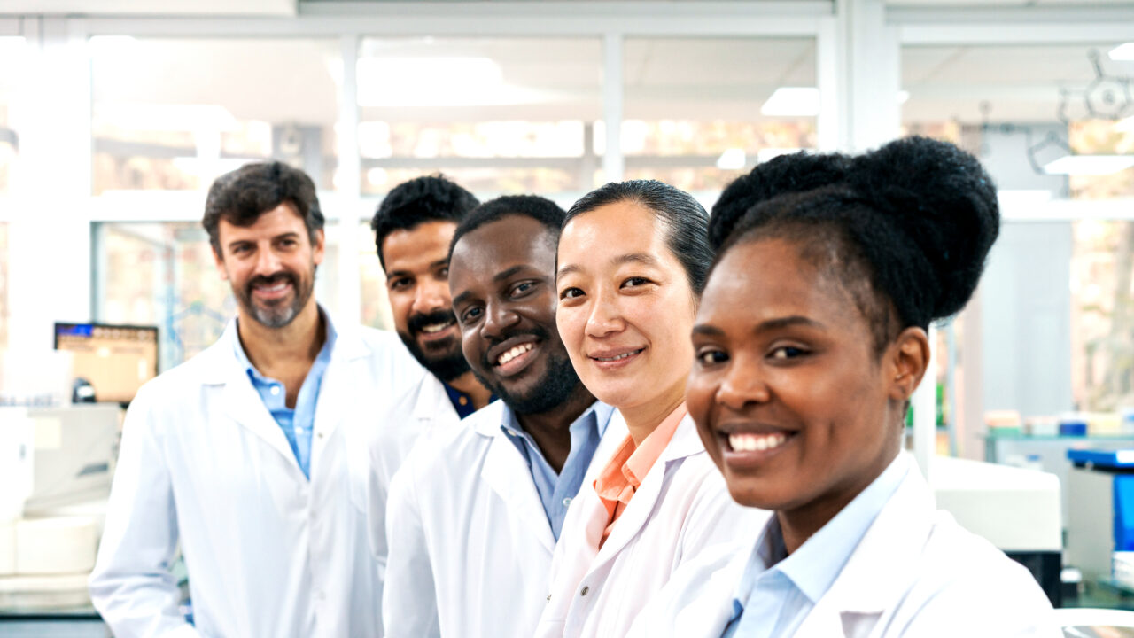 Portrait of multiracial male and female healthcare workers in laboratory